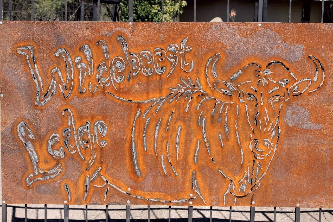The rustic Caldwell Safaris welcome sign