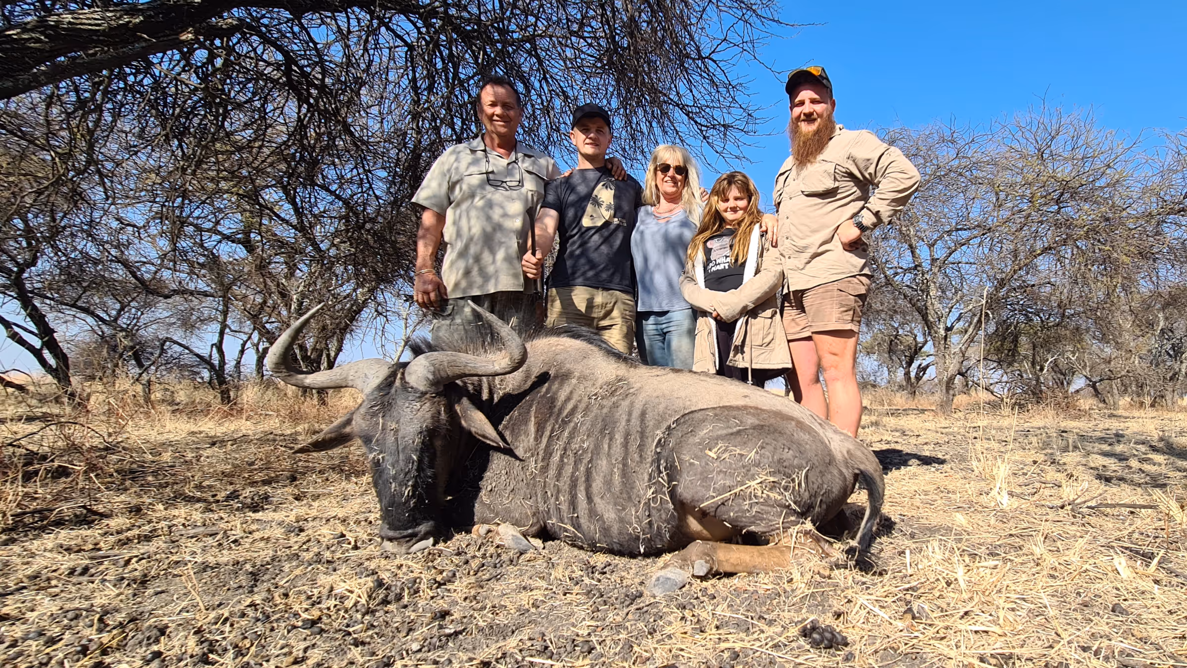 A family hunting party celebrating a memorable safari
